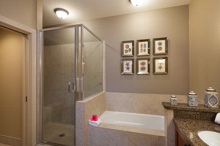- Pamper yourself in the oversized soaking tub or separate glass walk in shower - Artistic seashell and coral prints add a colorful, nature inspired flair - Perfect for unwinding after a day in the sun or a sunset stroll on the beach