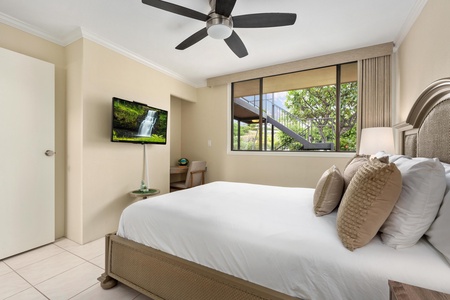 - Queen bed faces a mounted TV and a corner desk, perfect for work or downtime - Large window frames garden views and fills the room with natural light - Clean lines and a soft palette create a peaceful place to recharge
