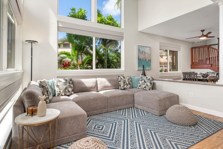 Sink into this plush sectional sofa where coastal comfort meets modern style. Natural light floods your space through oversized windows.