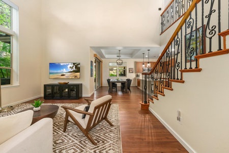 Unwind in your spacious living area with gleaming hardwood floors, comfortable seating, and an open flow to the kitchen—perfect for relaxing evenings.