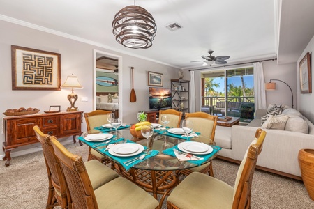 Your elegant dining space features tropical touches and stunning views of swaying palms through floor-to-ceiling windows.
