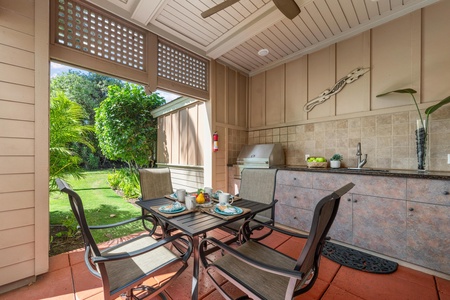 Your private outdoor kitchen and dining area opens to lush garden views, perfect for tropical morning meals.