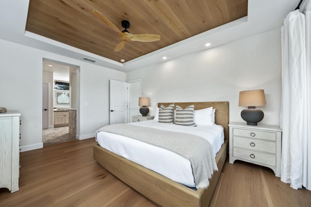 Drift into peaceful sleep under soaring wood ceilings with gentle ceiling fan breezes and crisp white linens awaiting your arrival.