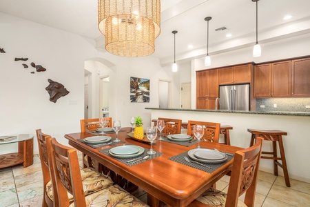 Your elegant dining space features rich wood furnishings and tropical Hawaiian décor, creating the perfect setting for memorable meals together.