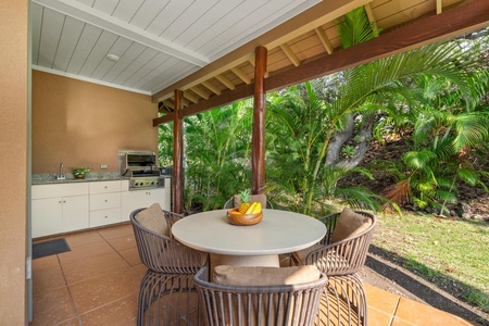 Dine al fresco in your tropical outdoor kitchen, surrounded by lush palms and volcanic rock gardens.