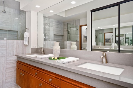 - Elegant double vanity with stone counters, sleek under mount sinks, and a bright mirror wall - Stylish cabinetry provides plenty of storage for long stays - Perfect setup for couples or shared use without sacrificing comfort or space