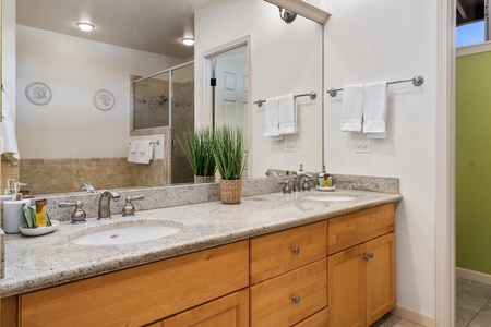 Clean and bright bathroom with double vanity, plenty of drawers, and open layout.
