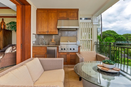 Step out onto your private balcony with a fully equipped outdoor kitchen, perfect for grilling and dining al fresco while surrounded by lush tropical greenery and relaxing island breezes.