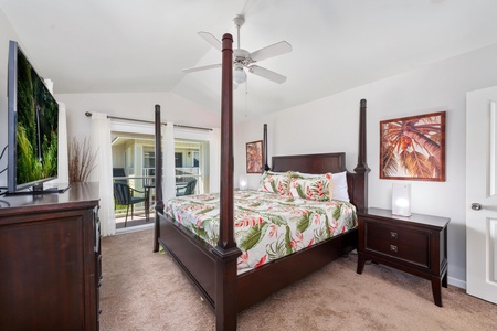 - Unwind in a spacious bedroom featuring a bold four poster bed and tropical decor - Sliding doors open to a private balcony perfect for enjoying fresh island air - Crisp white walls and ceiling fan add to the calm and breezy ambiance