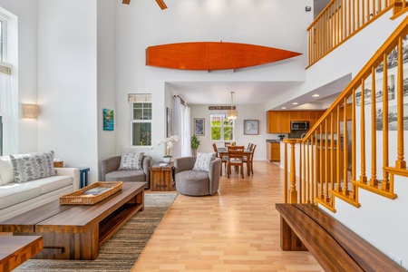 Spacious living and dining area under vaulted ceilings.