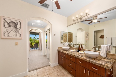 Primary bathroom with double vanity, walk-in shower, and soaking tub