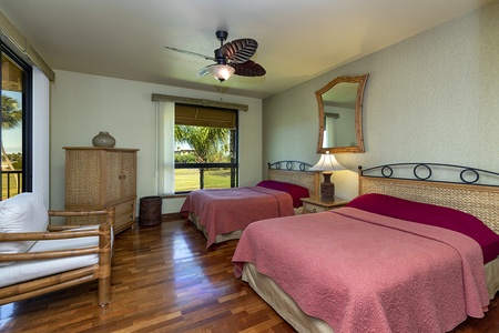Cozy guest bedroom with two queen beds.