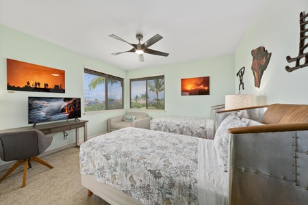 Your comfortable twin bedroom features tropical views, vibrant artwork, and modern amenities for a perfect island retreat.