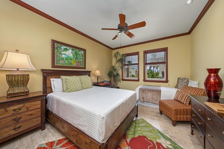 Your tropical retreat awaits—sink into plush bedding, unwind in the cozy seating area, and enjoy warm Hawaiian breezes from your ceiling fan.