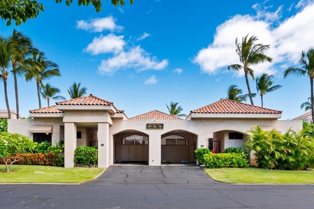 Mediterranean style villa with terracotta roofs and twin garages.