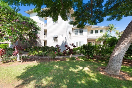 Exterior view of the residence with manicured greenery.