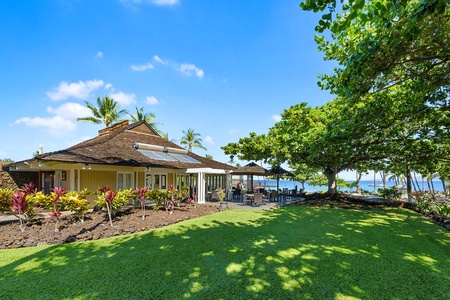Charming clubhouse with shaded patio overlooking the water.