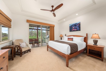 Unwind in your serene bedroom featuring a plush king bed, tropical garden views, and warm wood accents that create the perfect island retreat.
