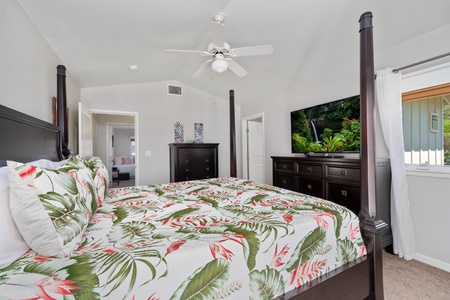- Enjoy late night movies or morning news from the comfort of your king bed - Large flat screen TV sits on an elegant dark wood dresser for a cozy setup - Neutral walls and ceiling fan complete the calming retreat feel