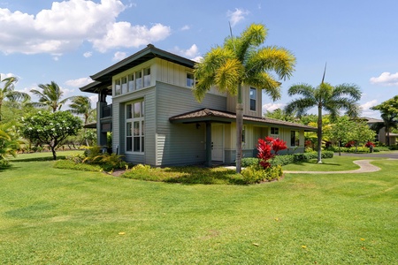 Two-story townhouse with tropical landscaping