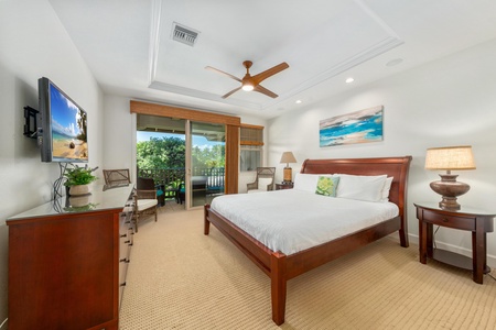 Drift off to sleep in this serene bedroom where warm wood tones meet crisp linens and your private balcony invites morning coffee moments.