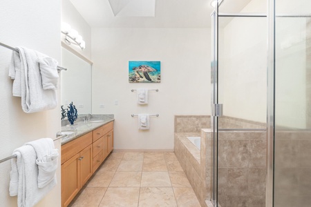 Your spacious master bathroom offers dual vanities, a soaking tub, and separate glass shower for ultimate relaxation.