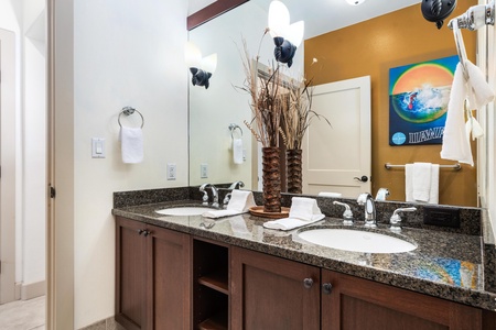 Guest bathroom with double vanity and shower / tub combo