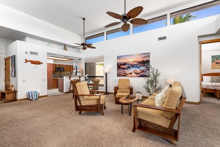 Relax in your spacious open-concept living area with stylish tropical furnishings