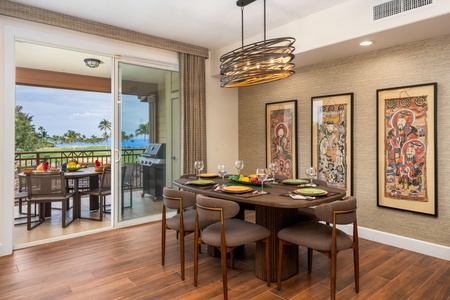 Gather around your elegant dining table where memorable meals unfold, with tropical breezes flowing through open doors to your private balcony paradise.