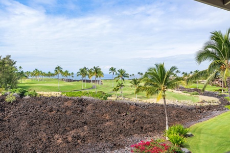 Stunning golf course views with tropical landscaping and volcanic rock formations create a dramatic Hawaiian setting.