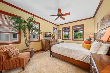 Drift off in your island-inspired bedroom, where tropical charm meets comfort. Plush bedding, warm wood tones, and cheerful pops of color create a relaxing retreat after your day's adventures.