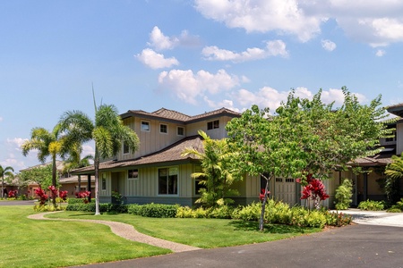 Two-story townhouse with tropical landscaping