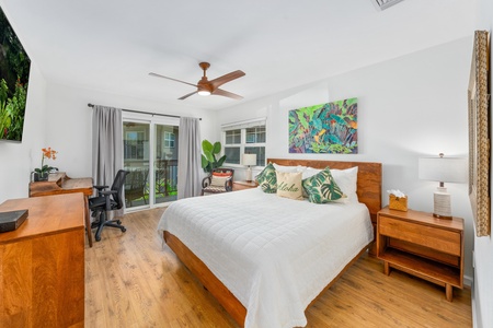 Spacious primary bedroom with bright natural light.
