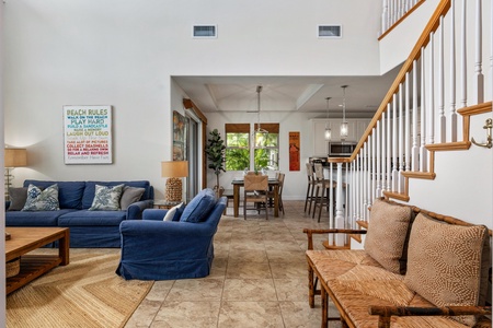 Open concept layout connects living room, dining, and kitchen