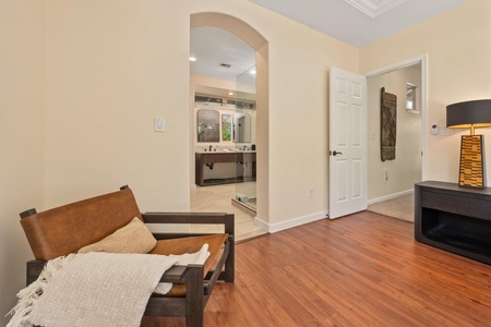 Unwind in your elegant suite where warm wood floors meet cozy furnishings and your private spa-like bathroom awaits.