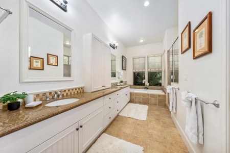 Your spacious master bathroom features dual vanities, a soaking tub, and walk-in shower for ultimate relaxation.