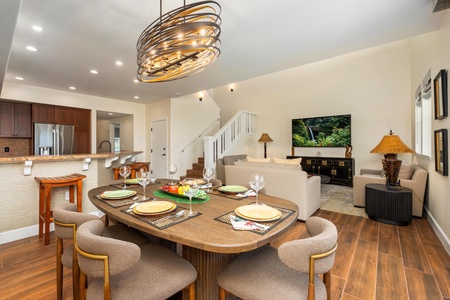 Gather around your elegant dining table where warm lighting and stylish décor create the perfect atmosphere for memorable meals.