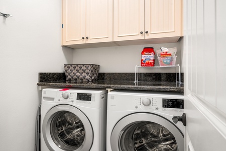 Laundry room with full size washer and dryer