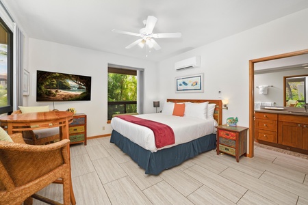 - Bright and cozy king bedroom with pops of color and stylish tropical decor - Dual nightstands offer extra storage and convenience on both sides of the bed - Large window and ceiling fan keep the room fresh and naturally lit
