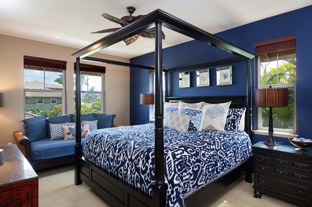 - Sophisticated second king bedroom with a bold navy feature wall and luxe four poster bed - Coordinated patterns and plush pillows bring out modern tropical charm - Enjoy peaceful views and a soft breeze from the large sunlit windows
