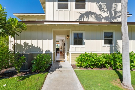 Welcoming front walkway leading into the home.