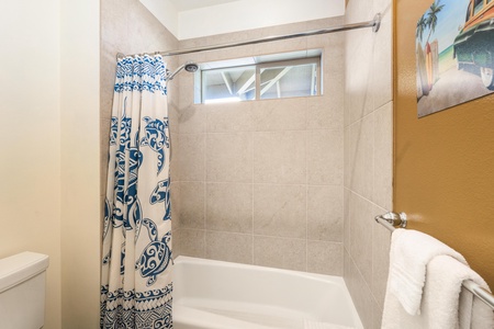 Guest bathroom with double vanity and shower / tub combo
