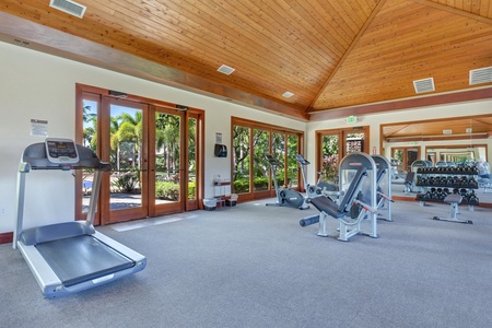 Stay active in your fully-equipped fitness center, featuring cardio machines and free weights under beautiful vaulted wood ceilings with tropical garden views.