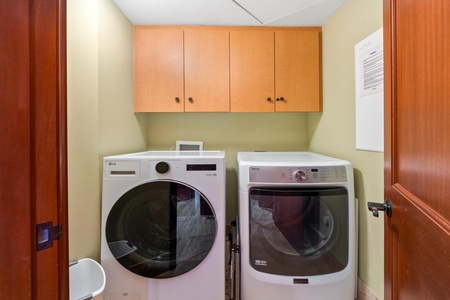 Fresh towels and clean sheets are easy with your private washer and dryer, tucked neatly away with overhead storage for your convenience.