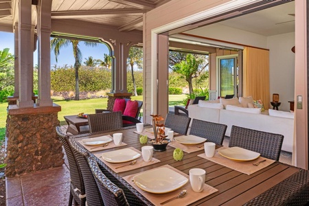 - Seamless indoor outdoor flow connects the dining area to the beautiful outdoors - Spacious table set for meals with garden views and gentle breezes - Sliding doors open wide to create a tropical alfresco experience