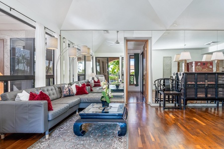 Living room with vaulted ceiling and outdoor access