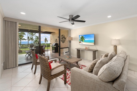 - Enjoy ocean views and TV entertainment from the same cozy island inspired space - Neutral tones and red pops of color give this room a relaxed coastal vibe - Sliding glass doors lead to a lanai perfect for alfresco meals and lounging