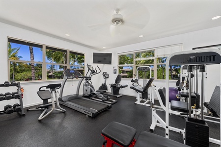 Work out while enjoying tropical views through floor-to-ceiling windows. Professional equipment and palm tree vistas make every session inspiring.