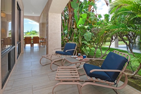 - Cozy seating under shaded arches offers beautiful garden views and quiet retreat - Perfect for sipping coffee or enjoying a midday book surrounded by greenery - Overlooks the tropical landscape with plenty of natural airflow