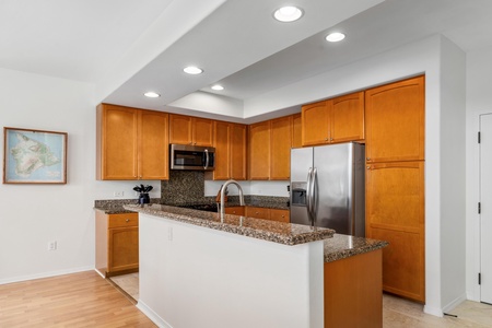 Open kitchen with breakfast bar.